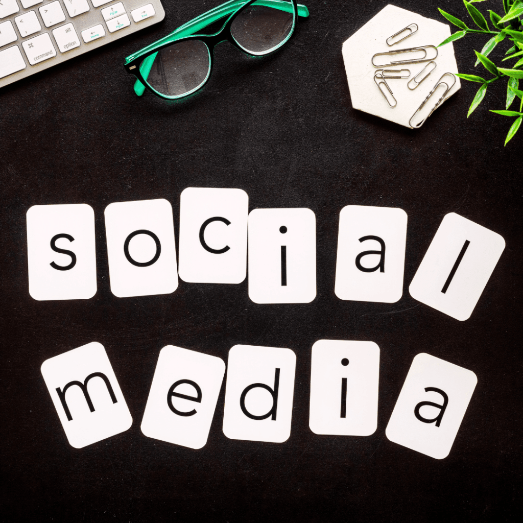 Social Media Management spelled up with letters laid out over a desk.